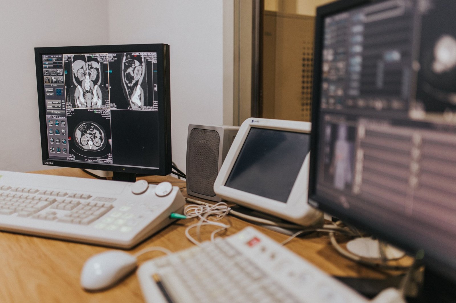 Specialist reviewing scans and pathology records during a mesothelioma second opinion for veterans