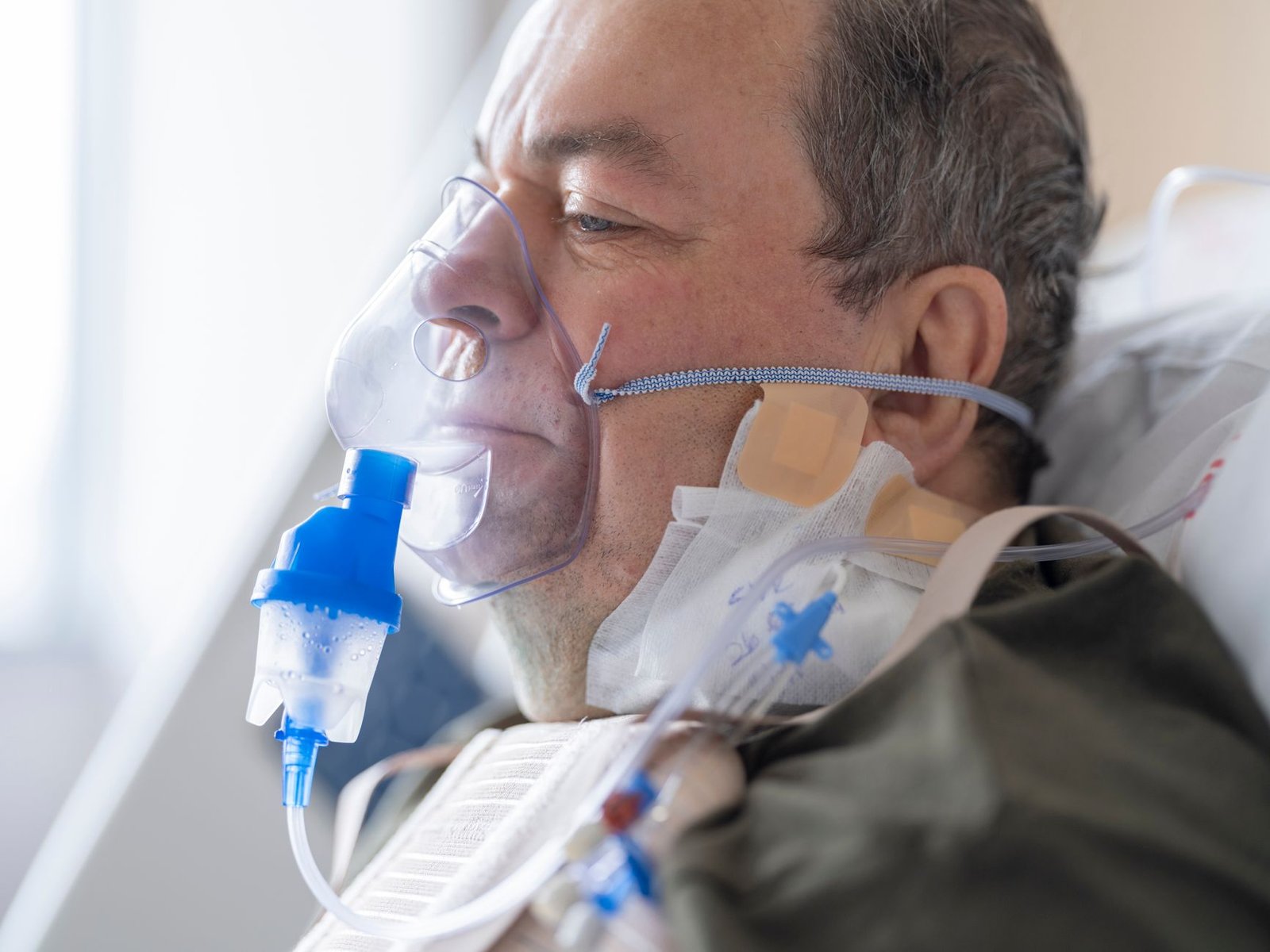 Older veteran completing a breathing study during VA pulmonary function tests for asbestos claims