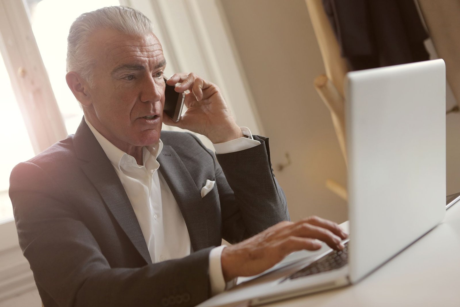 Veteran discussing immune-based mesothelioma treatment options with his oncologist