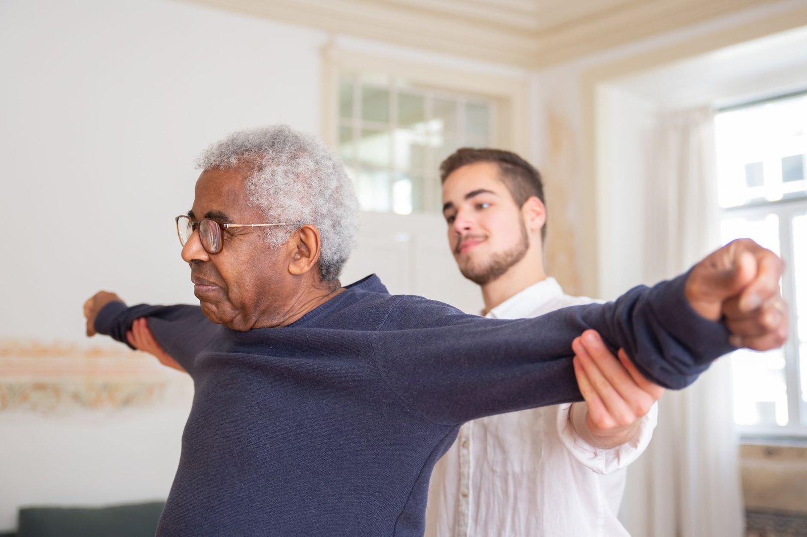 An older veteran works with a VA physical therapist during rehab after mesothelioma surgery