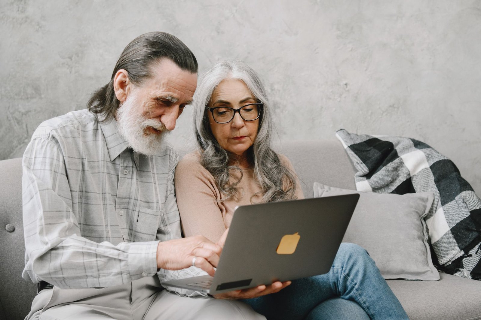 Veteran and spouse reviewing VA health records together through the VA patient portal for veterans