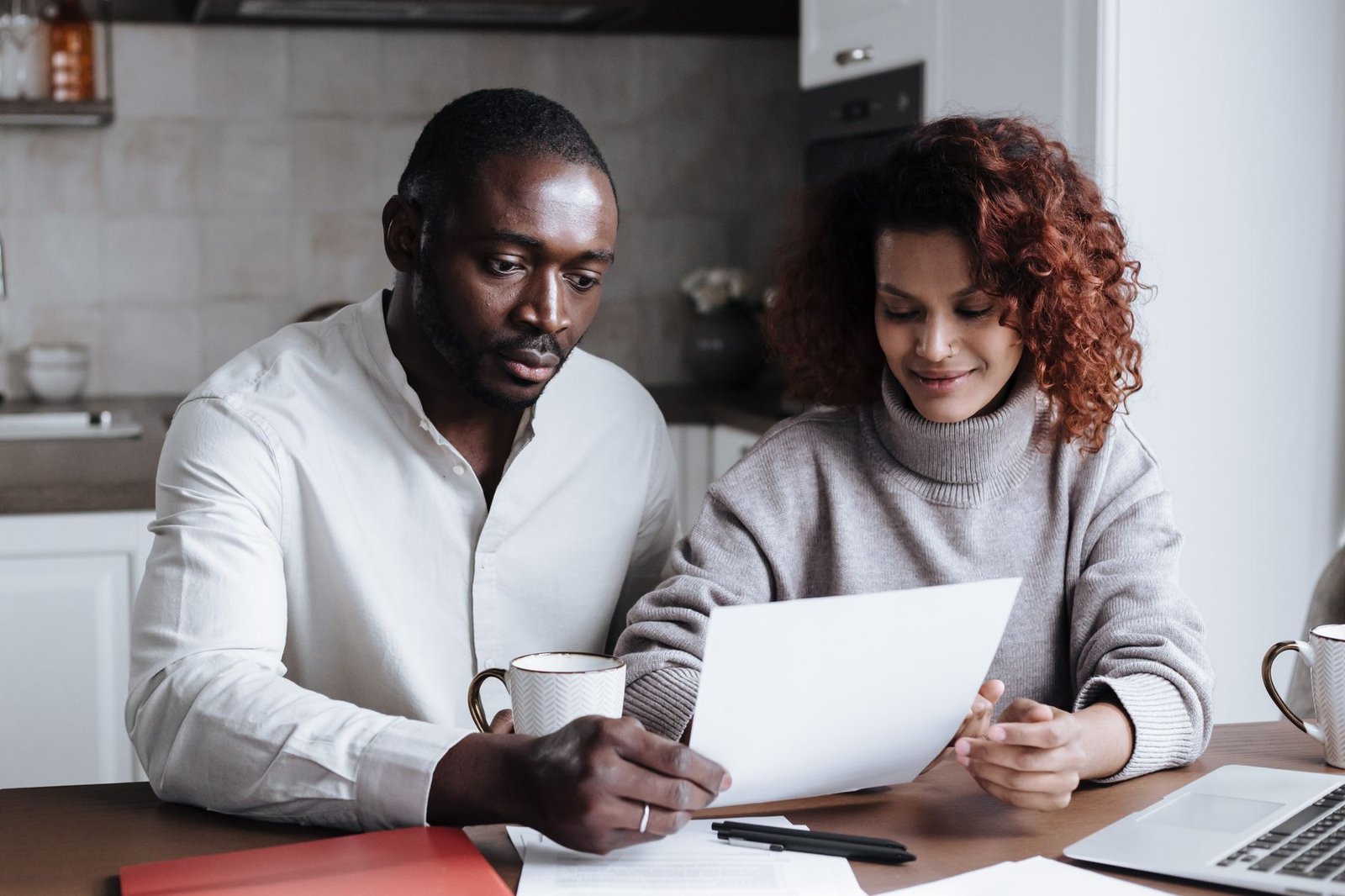 Veteran and spouse reviewing a VA cancer pain care plan together at home